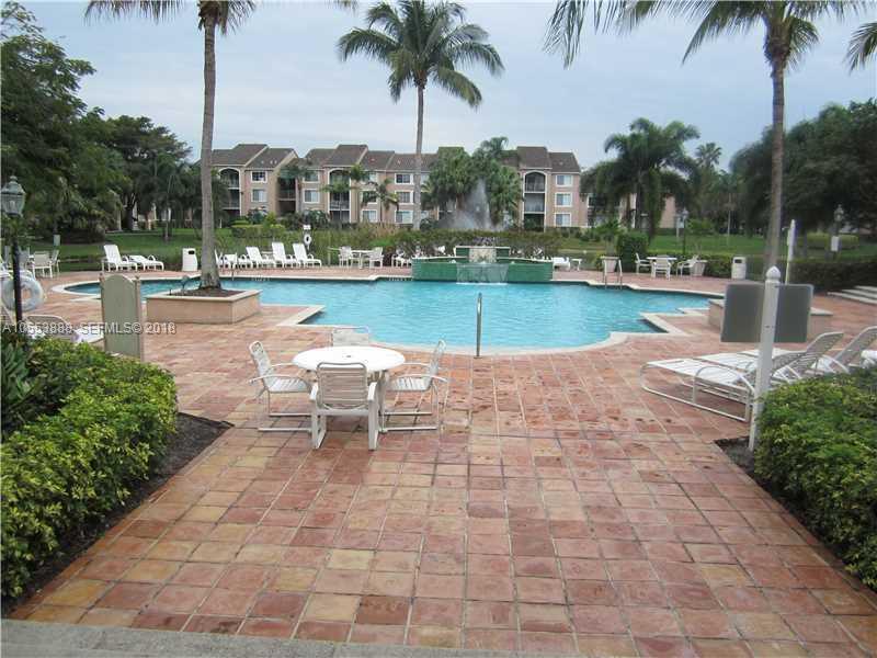 An empty room with white walls, beige tile flooring, and a window with vertical blinds — 12172 St Andrews Place # 211, Miramar FL 33025, MIRAMAR, FL