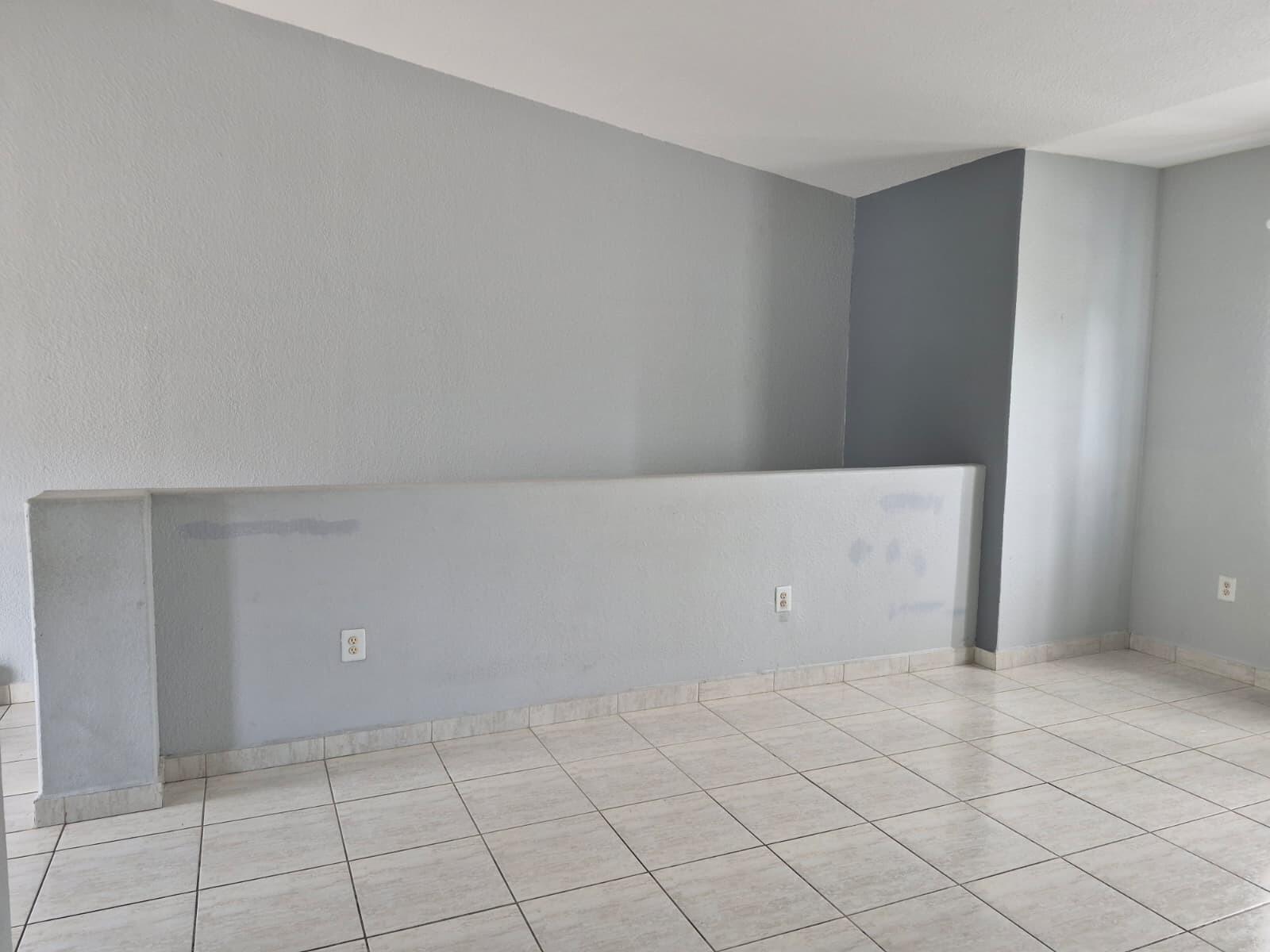 An empty room with light gray walls, a half-wall partition, and light-colored tiled flooring — 7211 NW 174th Terrace # 203, Hialeah FL 33015, HIALEAH, FL