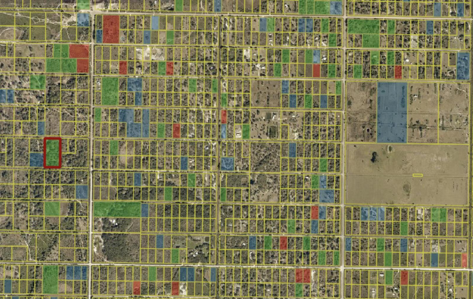 This map shows a grid of land parcels with some lots highlighted in red, green, and blue — 296th NW 296th Street, Okeechobee FL 34972, OKEECHOBEE, FL