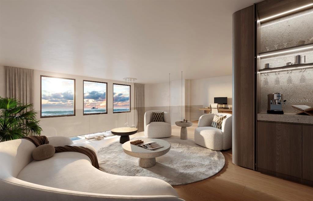 This rendering shows a modern living room with ocean views, curved furniture, and a wet bar — 6645 N OCEAN SHORE BOULEVARD UNIT 6B, PALM COAST, FL