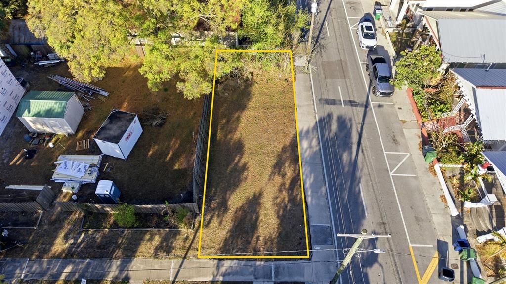 An aerial view shows a vacant, rectangular residential lot outlined in yellow next to a street — 2616 N 19TH STREET, TAMPA, FL