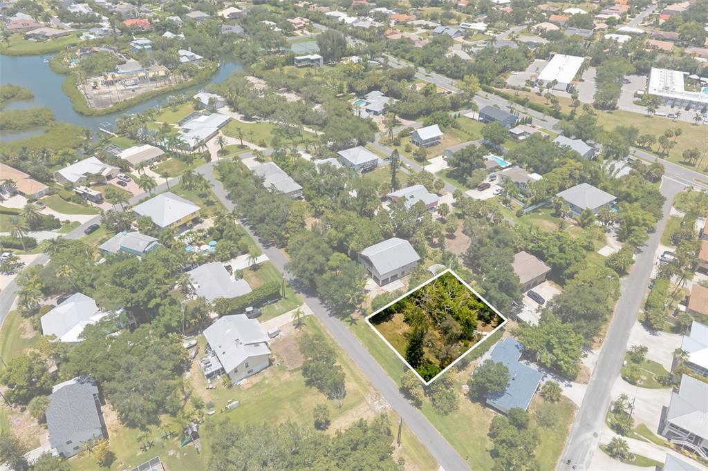 An aerial view shows a vacant, tree-covered residential lot highlighted in a suburban neighborhood — 0 WESTVIEW DRIVE, OSPREY, FL
