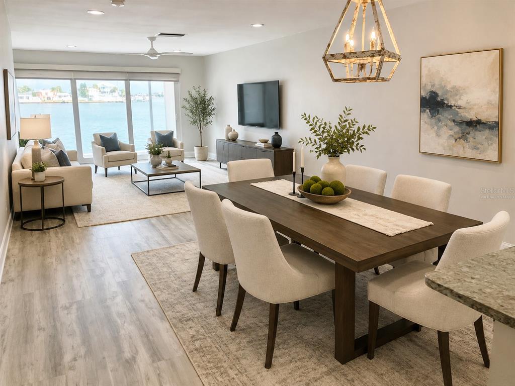 A modern open-concept living and dining area features light wood floors and waterfront views — 628 BOCA CIEGA POINT BOULEVARD S, ST PETERSBURG, FL