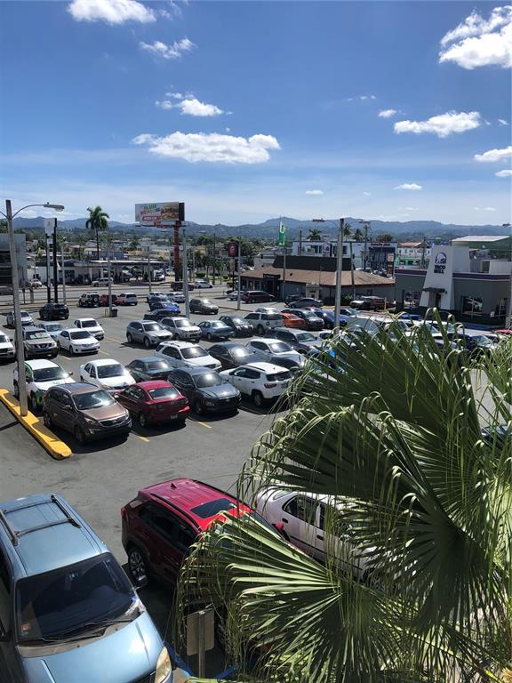 An elevated view of a parking lot filled with cars near a Taco Bell — 167 N RAMON L RIVERA, KM 21,3,FOREST HILLS PLAZA AVENUE N UNIT 2, BAYAMON, PR