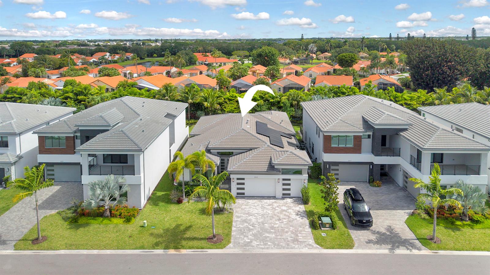 An aerial view shows a single-story house with a tiled roof and solar panels — 8533 Ganton Drive, Boca Raton FL 33434, BOCA RATON, FL