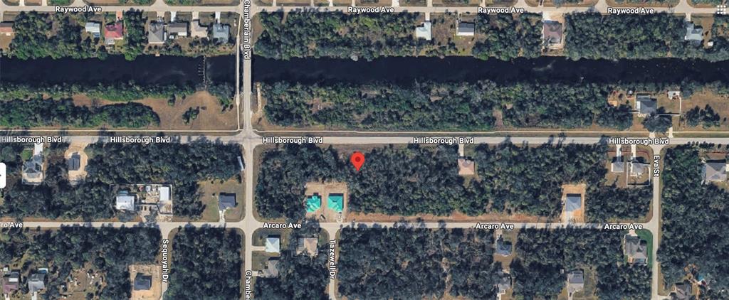 This aerial map shows a vacant, wooded residential lot located between Hillsborough Boulevard and Arcaro Avenue — 16213 HILLSBOROUGH BOULEVARD, PORT CHARLOTTE, FL