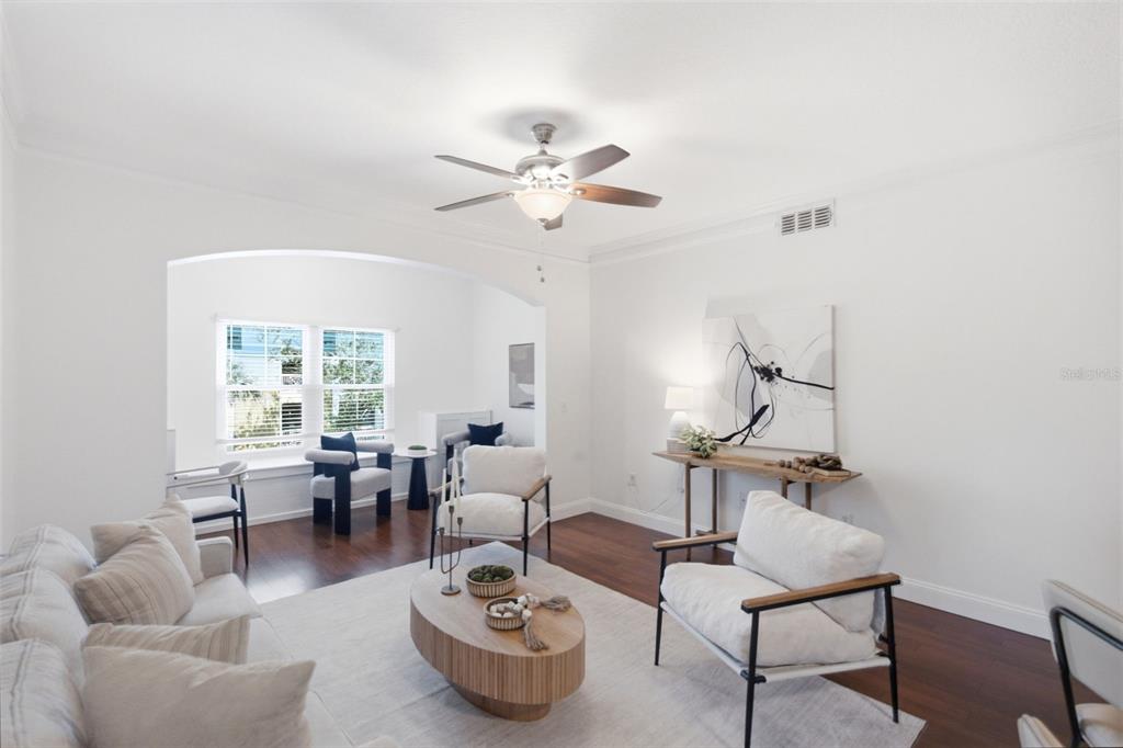 A living room features a sofa, two armchairs, a ceiling fan, and hardwood flooring — 4207 S DALE MABRY HIGHWAY UNIT 2301, TAMPA, FL