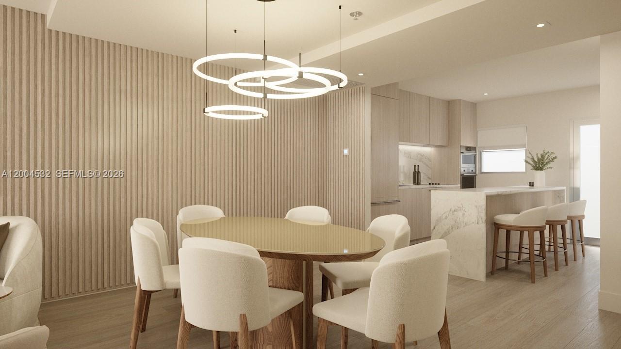 This rendering shows a modern dining area with a slatted wood wall and pendant lighting — 250 Collins Ave # 109, Miami Beach FL 33139, MIAMI BEACH, FL