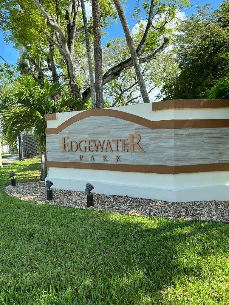 A stone monument sign for Edgewater Park stands in a grassy area with trees — 13413 SW 116th Ct # 0, Miami FL 33176, MIAMI, FL