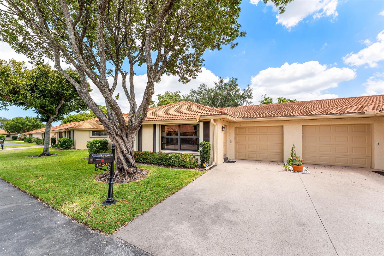 A single-story house with a tile roof, two garage doors, and a large tree — 4520 Ficus Tree Road, Boynton Beach FL 33436, BOYNTON BEACH, FL