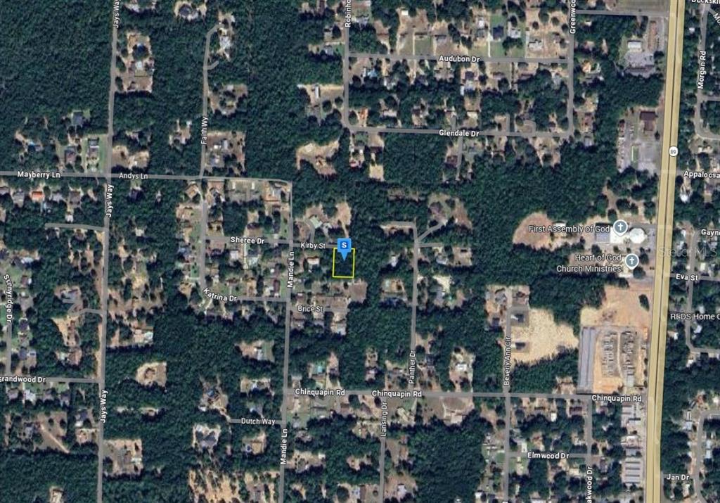 This is an aerial map view showing a highlighted residential lot in a wooded neighborhood — 6195 KIRBY STREET, MILTON, FL