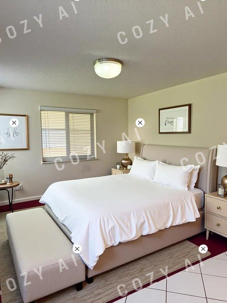 A bedroom features a queen bed with white bedding, a bench, and two nightstands — 1360 NW 19th Terrace # 101, Delray Beach FL 33445, DELRAY BEACH, FL