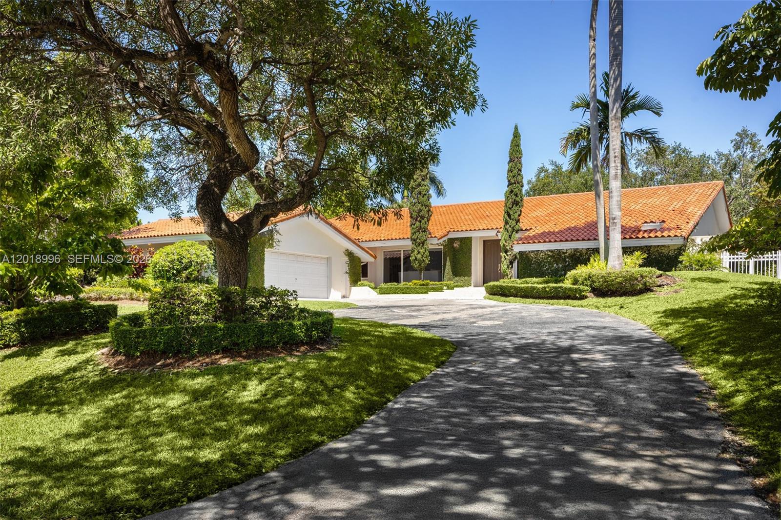 A single-story house with a terracotta tile roof and a curved driveway — 7230 Vistalmar St, Coral Gables FL 33143, CORAL GABLES, FL