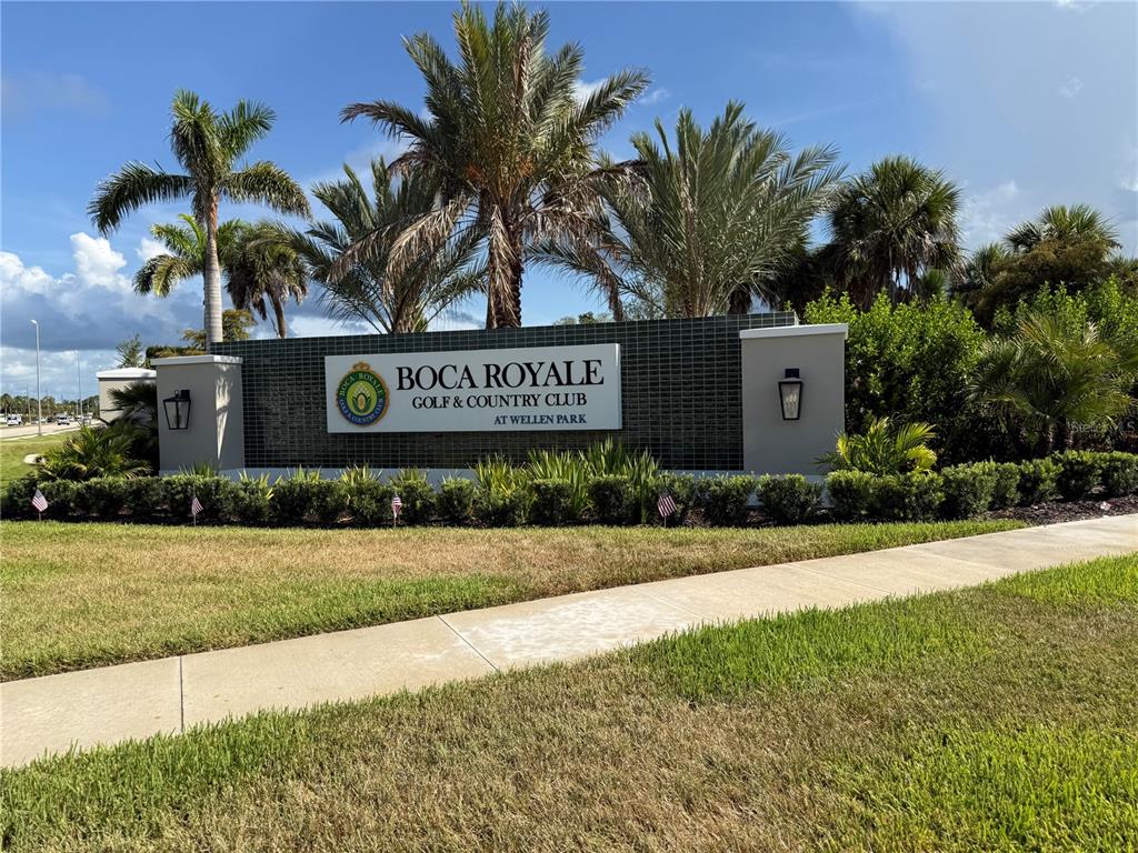 A green tiled monument sign displays the name Boca Royale Golf & Country Club — 10735 TROPHY DRIVE, ENGLEWOOD, FL