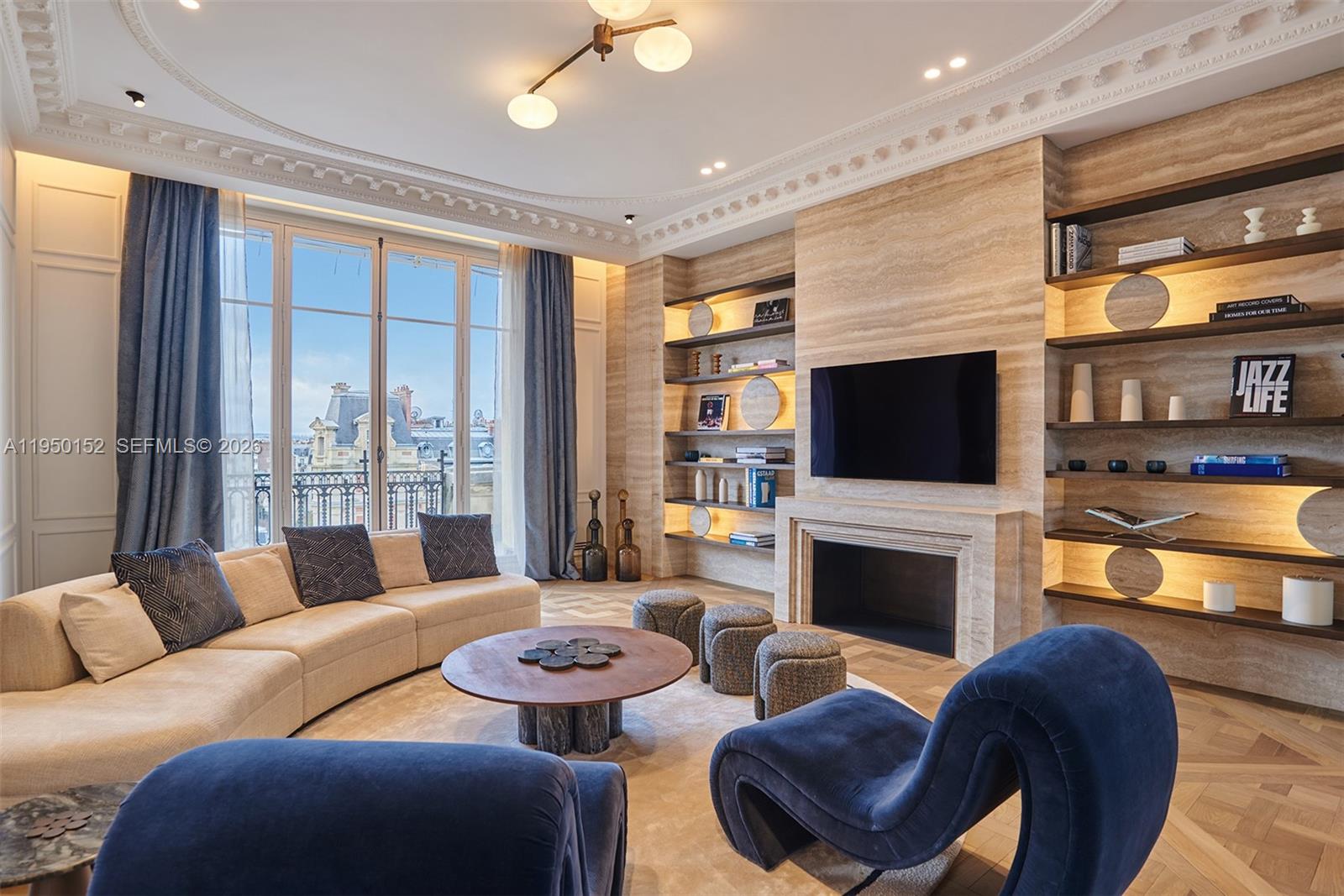 A living room features a fireplace, built-in shelves, a curved sofa, and large windows — 48 AVENUE GEORGES MANDEL, FR, FR