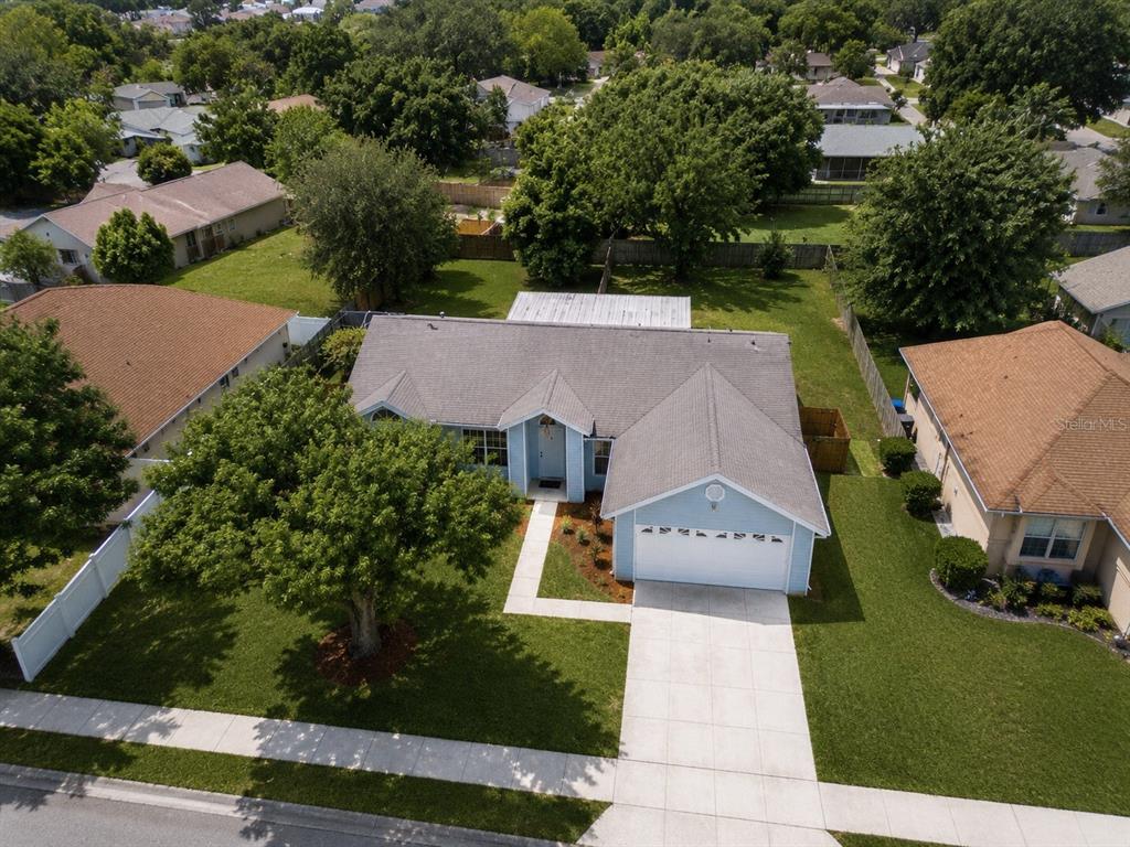 An aerial view of a light blue single-story house with a two-car garage — 5113 TIMBER RIDGE TR, OCOEE, FL
