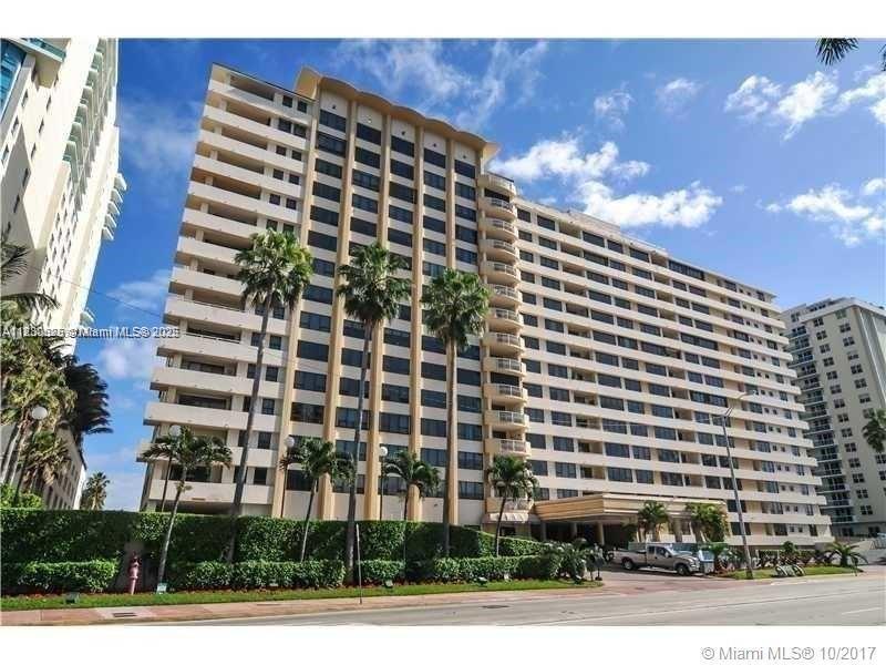 A multi-story residential building features balconies and palm trees along a street — 550 S Ocean Blvd # 1509, Boca Raton FL 33432, BOCA RATON, FL