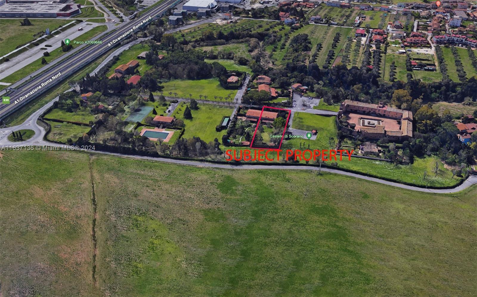 An aerial view shows a rural property with a house, pool, and nearby castle ruins — 4 NW Via tiberina, 00100, FL
