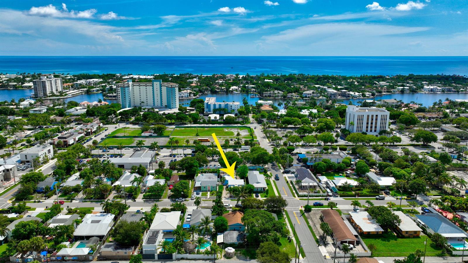 An aerial view shows a residential neighborhood with a yellow arrow pointing to a house — 629 SE 4th Avenue, Delray Beach FL 33483, DELRAY BEACH, FL