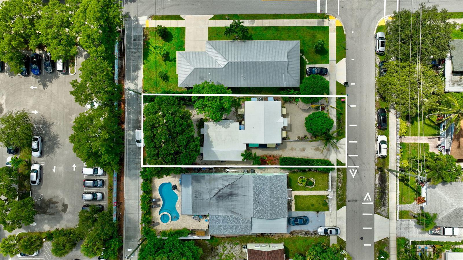 An aerial view shows a residential property with a white roof, trees, and surrounding streets — 629 SE 4th Avenue, Delray Beach FL 33483, DELRAY BEACH, FL