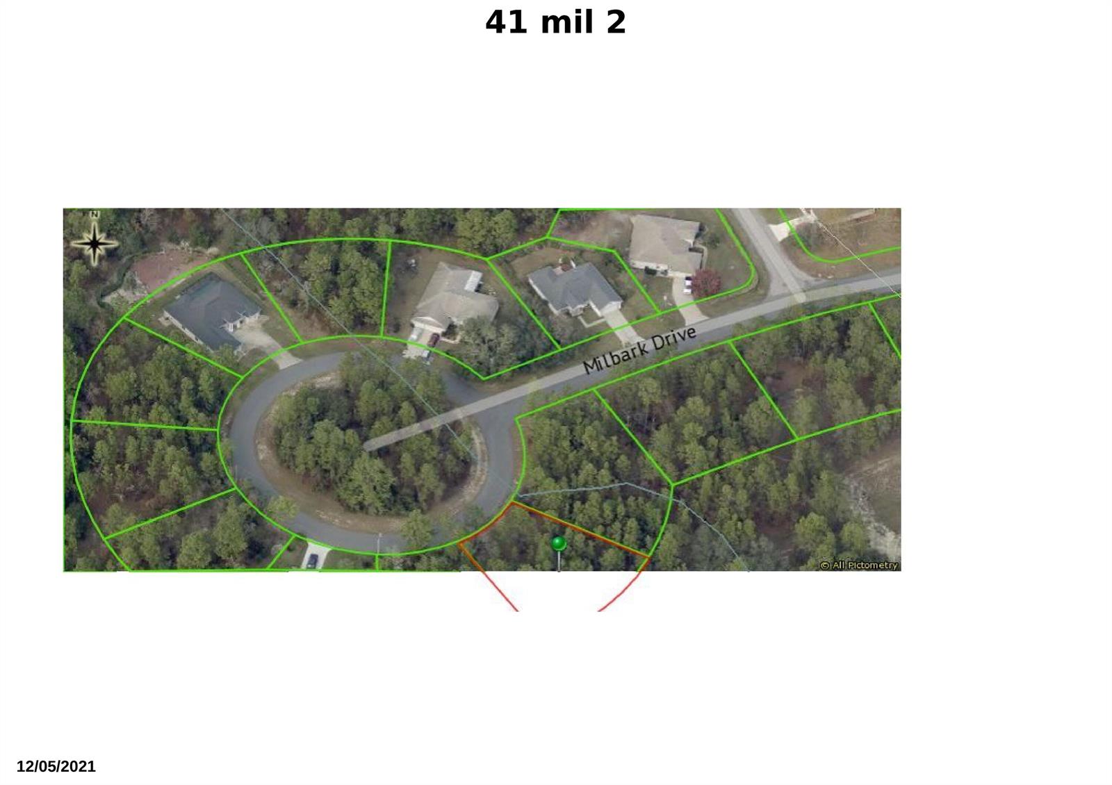 This is an aerial map showing a cul-de-sac with several residential lots outlined in green — 41 Milbark Drive, FL 34446, FL
