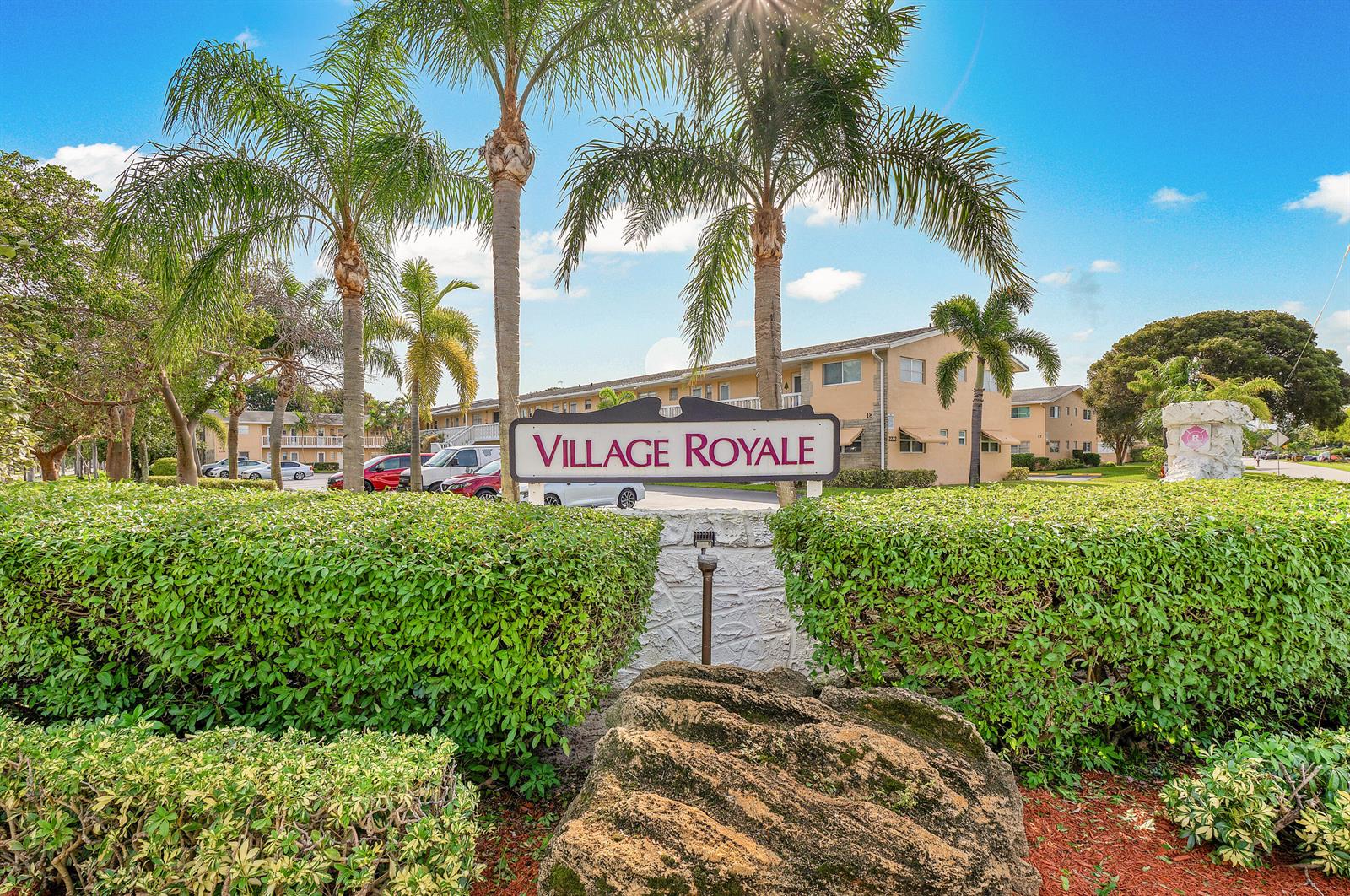 A sign for Village Royale stands in front of apartment buildings and palm trees — 108 NE 20th Avenue NE # 201, Boynton Beach FL 33435, BOYNTON BEACH, FL
