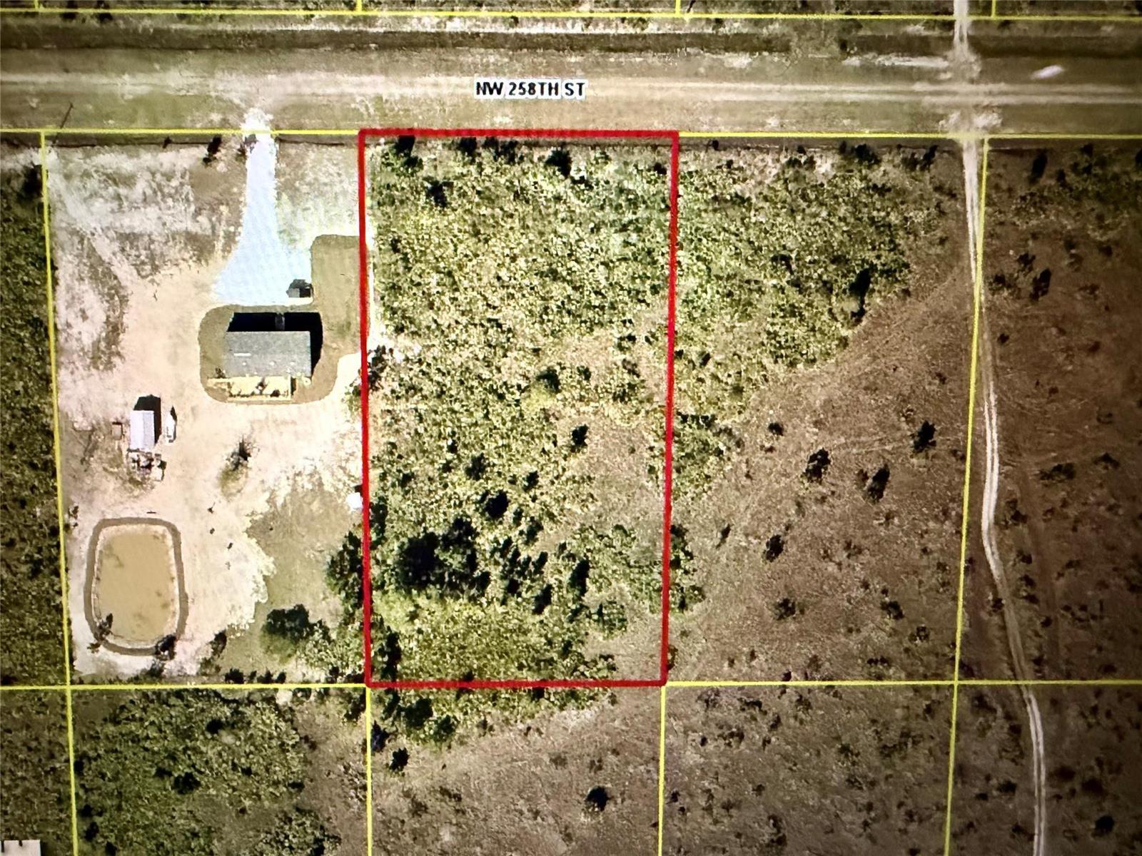 An aerial map shows a rectangular plot of land outlined in red along a road — 16318 NW 258th Street, Okeechobee FL 34972, OKEECHOBEE, FL