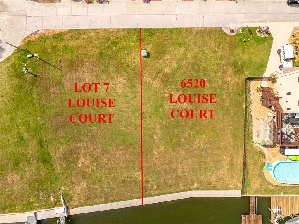 This aerial view shows two adjacent waterfront lots separated by a red line — LOT 7 LOUISE COURT, HUDSON, FL