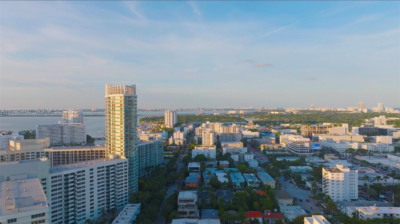 An aerial view shows a dense urban neighborhood with high-rise buildings near the water — 1330 West Ave # 3009, Miami Beach FL 33139, MIAMI BEACH, FL