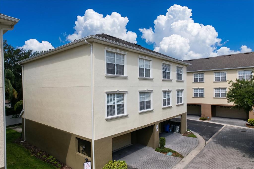 This is a three-level floor plan showing the layout of a residential home — 10144 ARBOR RUN DRIVE UNIT 31, TAMPA, FL