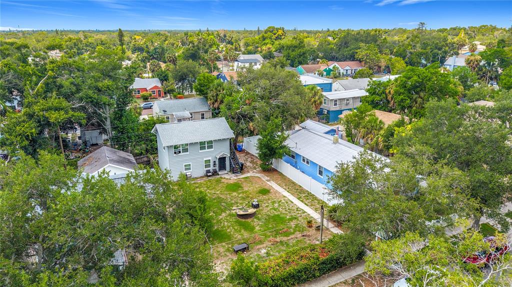 An aerial view shows two houses with a shared backyard and a fire pit — 800 15TH AVENUE S, ST PETERSBURG, FL