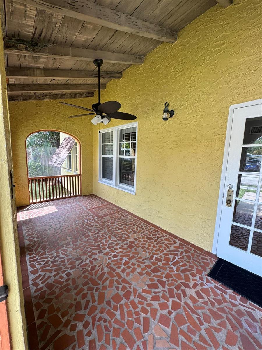 A covered patio with yellow stucco walls, a wooden ceiling, and a tiled floor — 226 NE 7th, Delray Beach FL 33483, DELRAY BEACH, FL