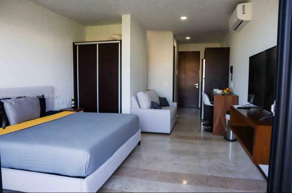 A studio apartment features a bed, a sofa, a small dining area, and tile flooring — Menesse Tulum C. Asteroide, Tulum Centro # 329, QR, QR