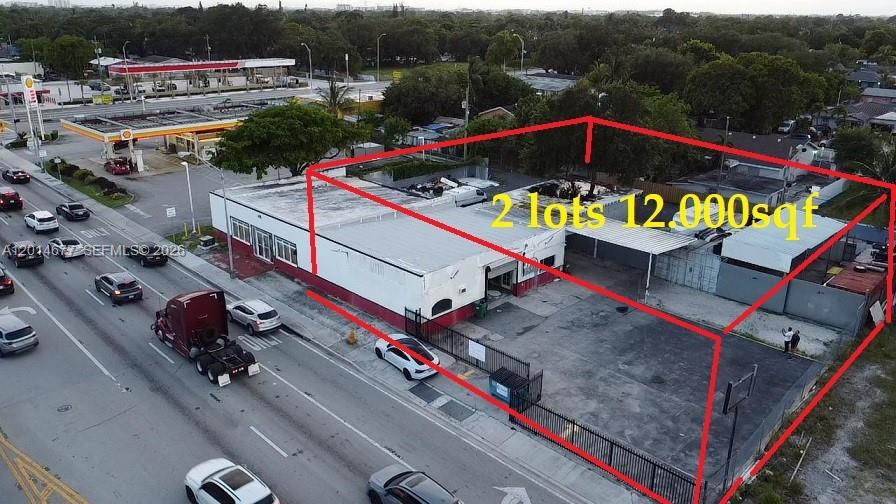 An aerial view shows a commercial building and paved lot outlined in red — 10400 SW 27th St, Miami FL 33165, MIAMI, FL