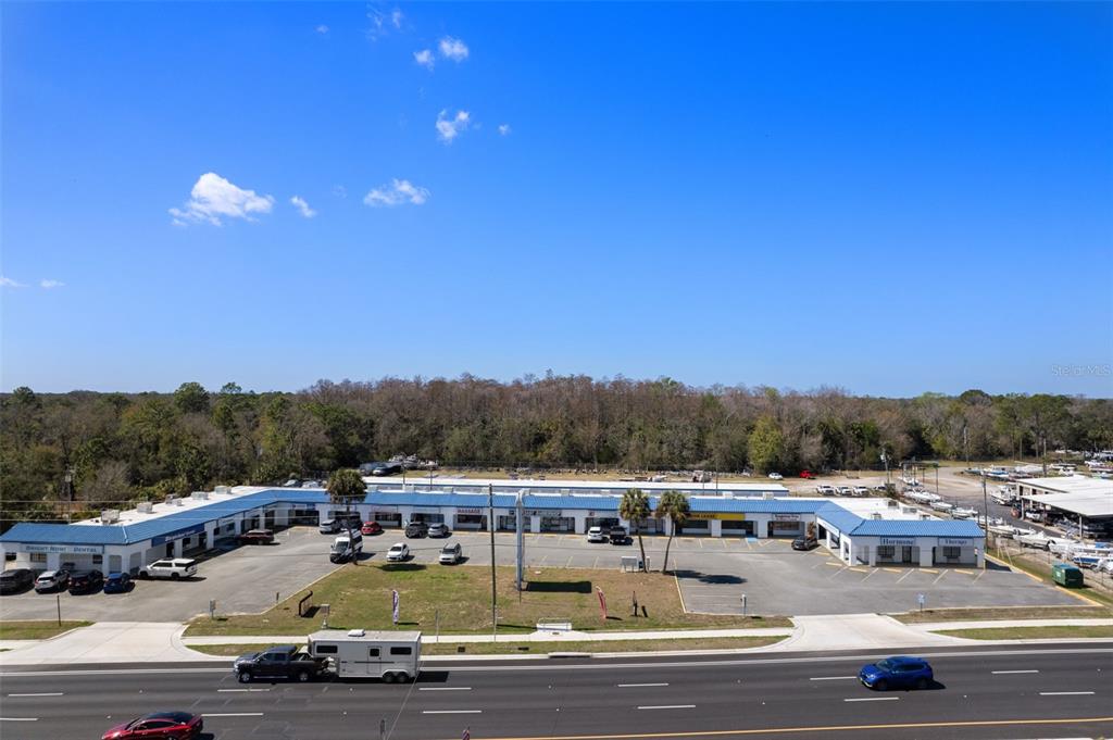 An aerial view of a single-story commercial strip mall with a parking lot — 940 N SUNCOAST BOULEVARD, CRYSTAL RIVER, FL