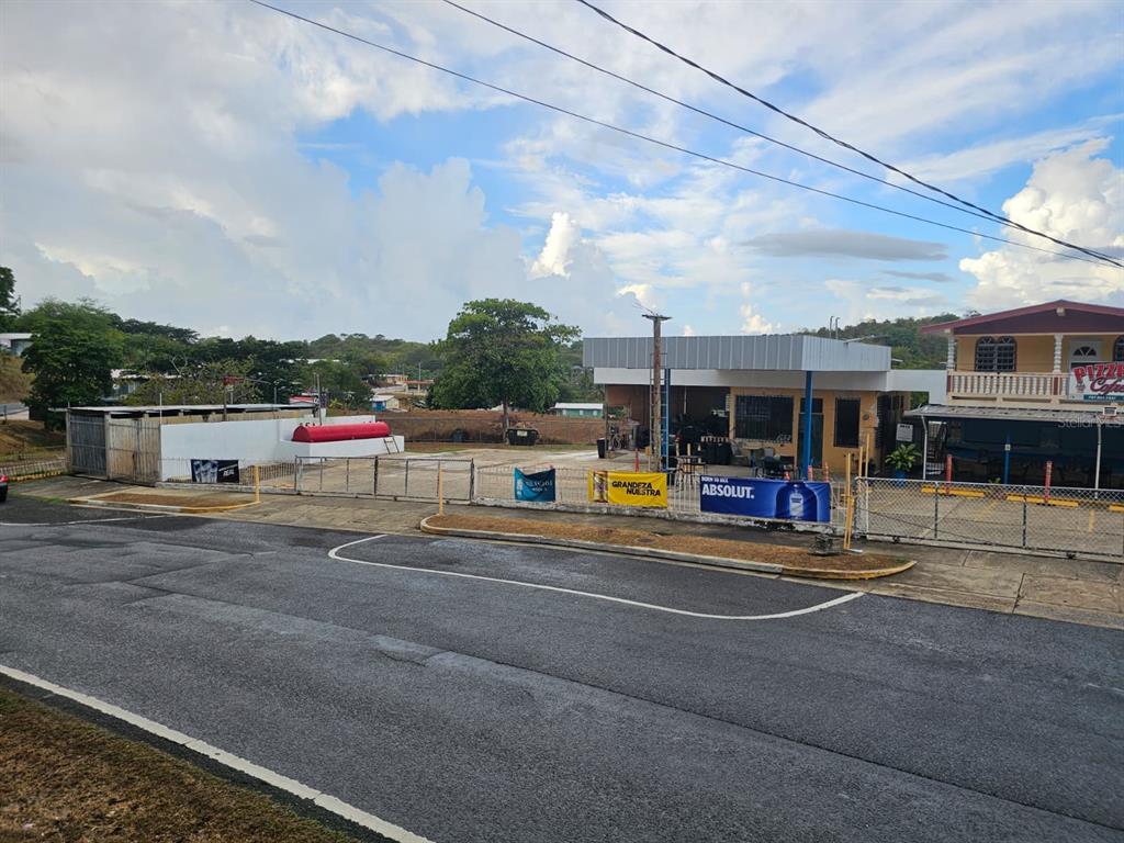 An outdoor view of a commercial property with a paved lot and a small building — Carr. 307, Km. 5.2 BARRIO PEDERNALES, CABO ROJO, PR