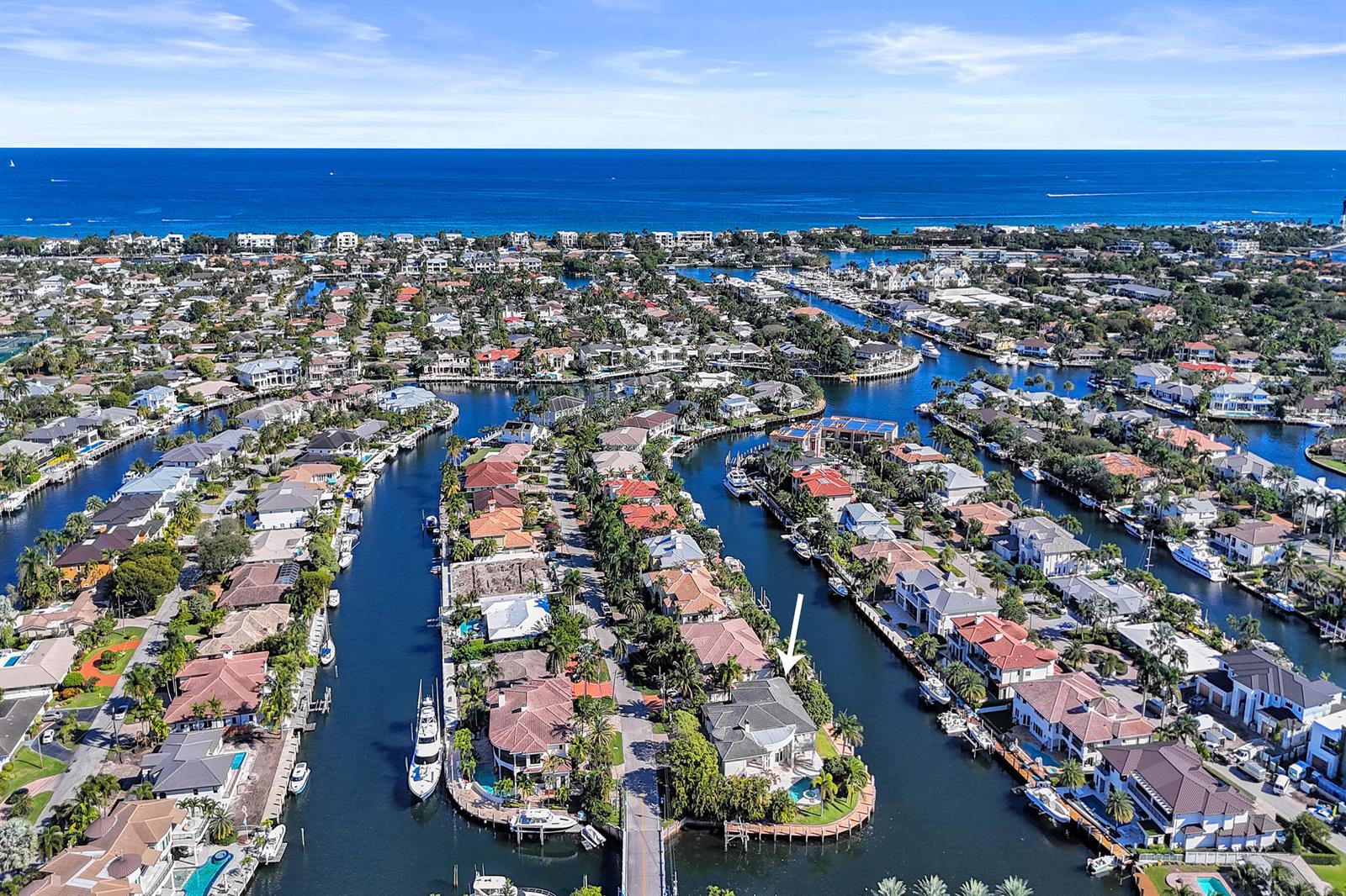 An aerial view shows waterfront homes along canals leading to the ocean — 2330 NE 31st Court, Lighthouse Point FL 33064, LIGHTHOUSE POINT, FL