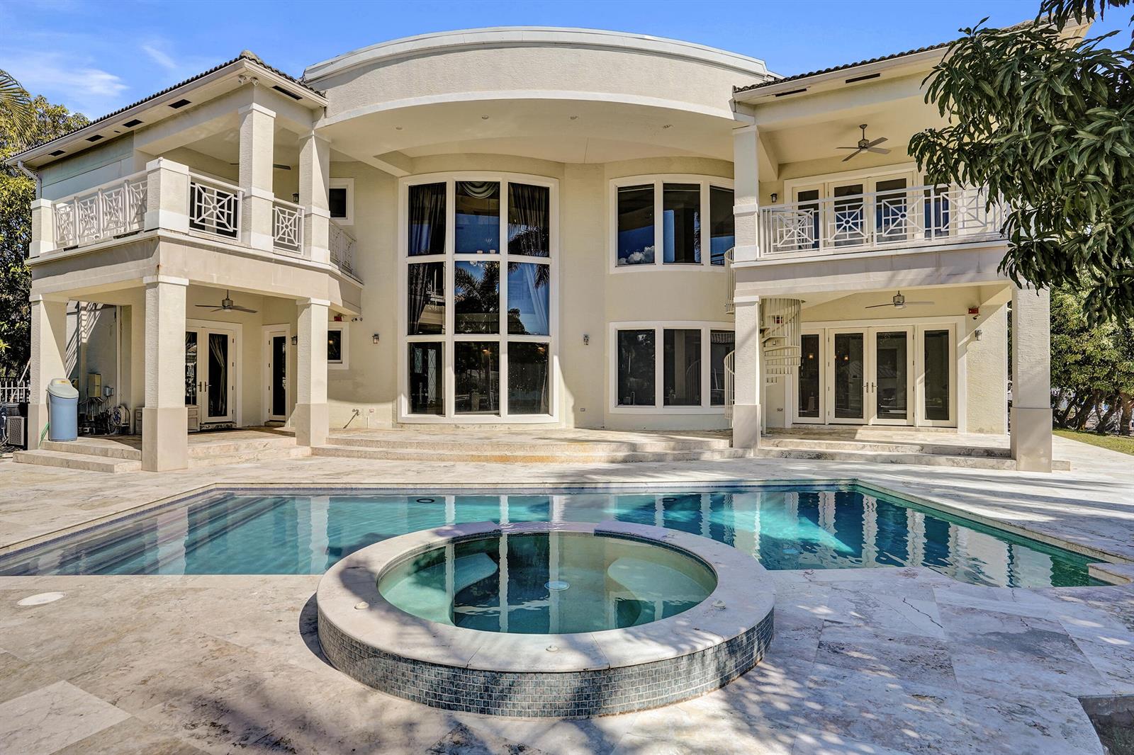 A large two-story house with a swimming pool, hot tub, and stone patio — 2330 NE 31st Court, Lighthouse Point FL 33064, LIGHTHOUSE POINT, FL