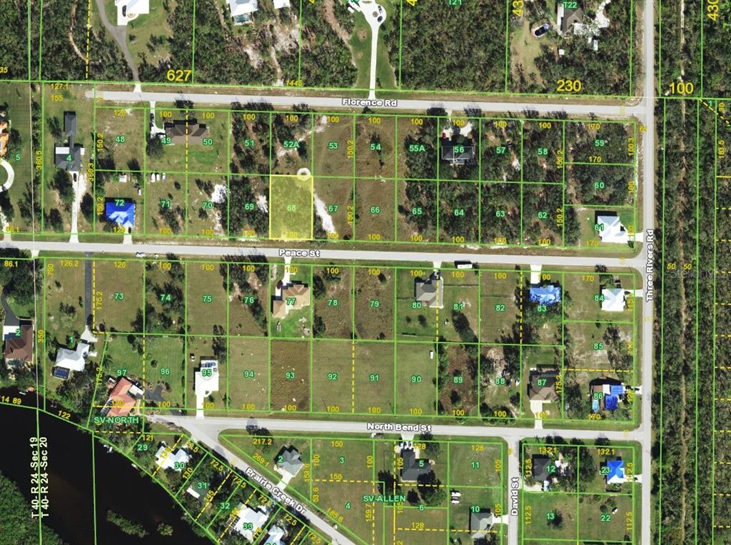 This is an aerial map showing residential lots, streets, and property boundaries in a neighborhood — 31062 PEACE STREET, PUNTA GORDA, FL