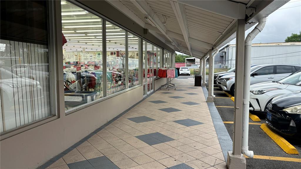 A covered walkway with tiled flooring runs along the front of a retail storefront — 115 STATE ROAD PR - 115, AGUADA, PR