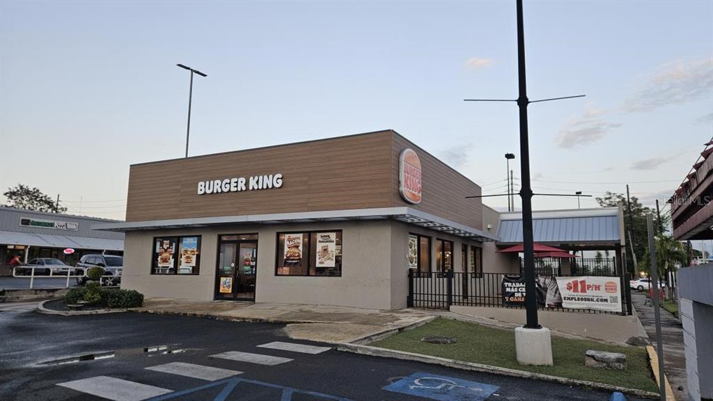 A Burger King restaurant exterior with a wood-paneled facade and a parking lot — 115 STATE ROAD PR - 115, AGUADA, PR