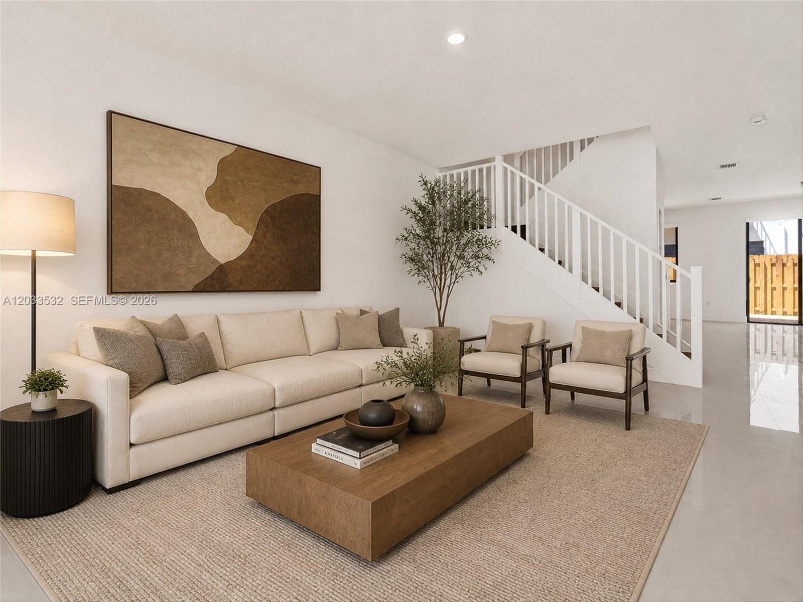 A modern living room features a beige sofa, two armchairs, a wooden coffee table, and stairs — 13642 SW 157th PL, Miami FL 33196, MIAMI, FL