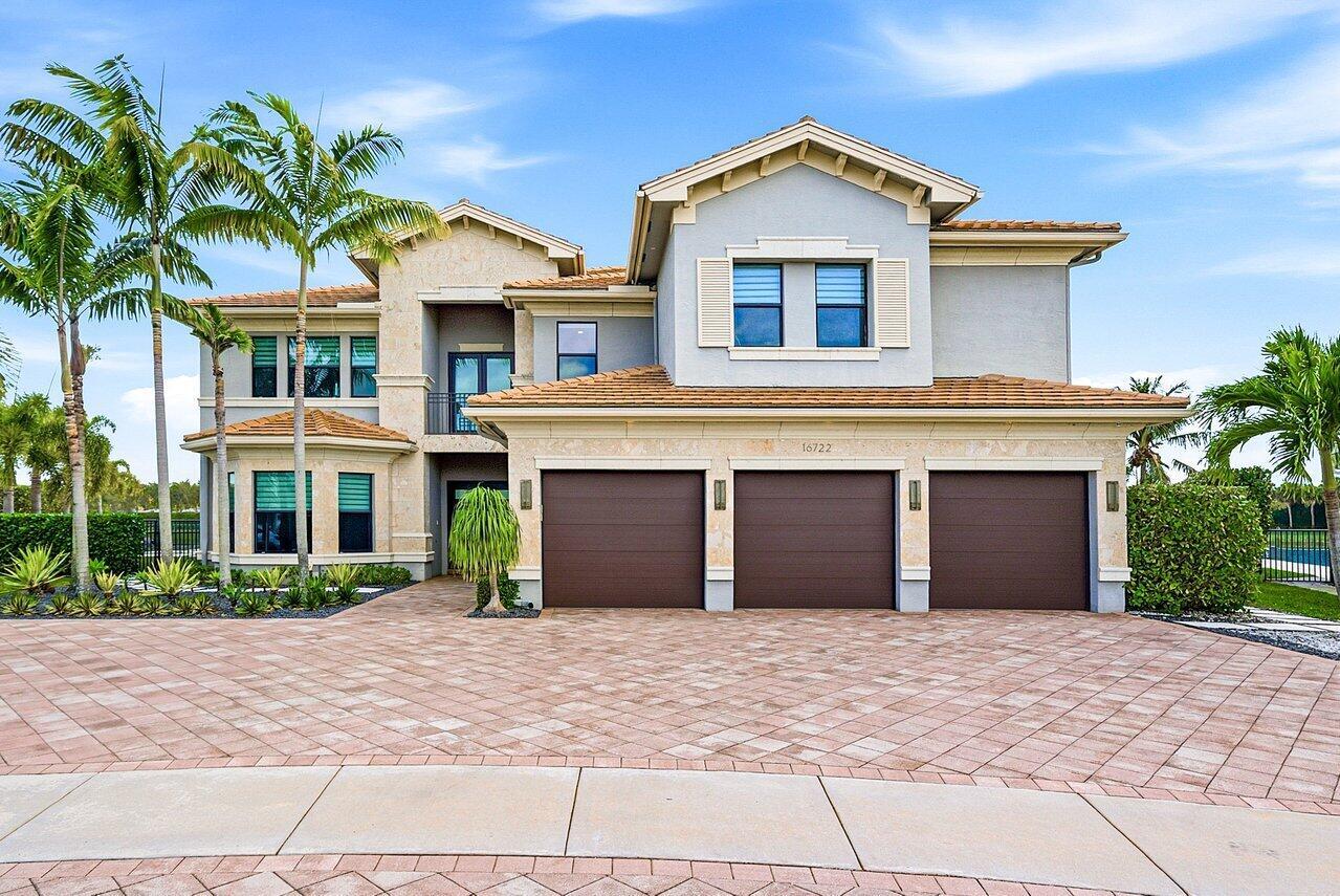 A two-story suburban house with a three-car garage and a paved driveway — 16722 Cannes Street, Delray Beach FL 33446, DELRAY BEACH, FL