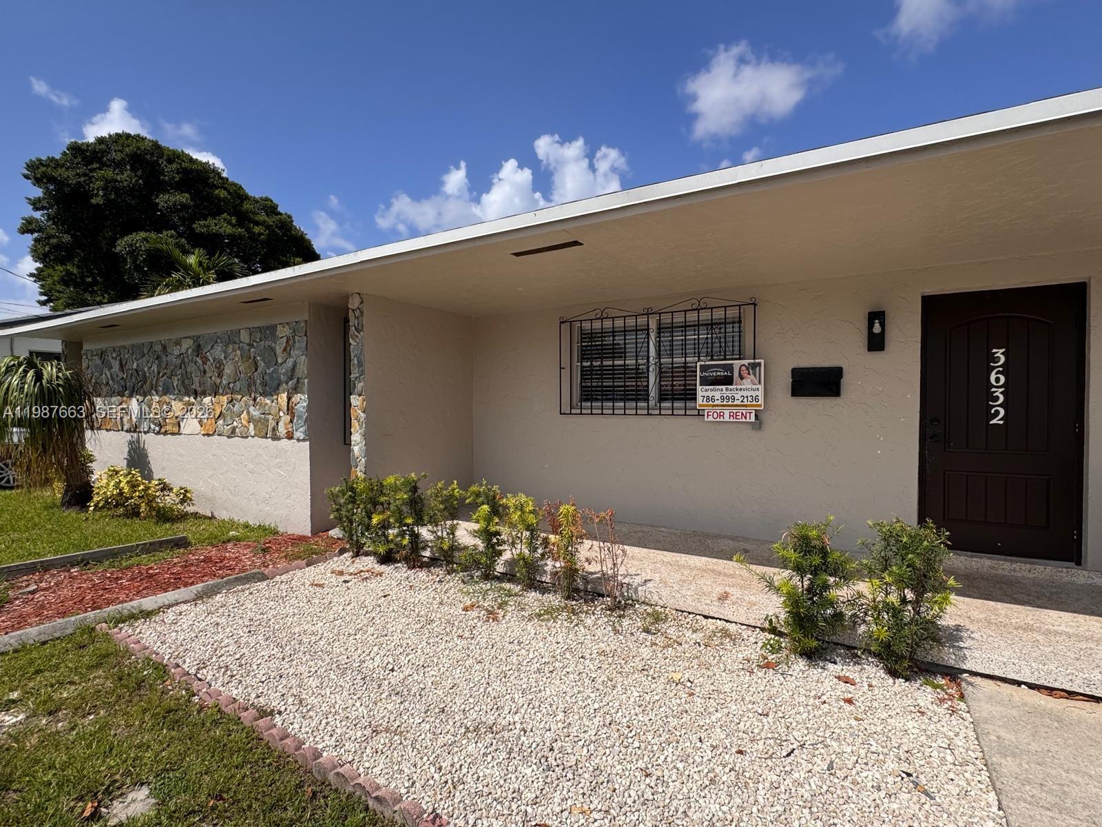 The exterior of a one-story house features a stone accent wall and a front door — 3630 SW 87th Ave, Miami FL 33165, MIAMI, FL