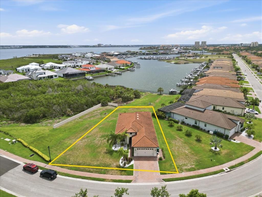 An aerial view shows a single-story house with a tiled roof on a corner lot — 2317 5TH STREET E, PALMETTO, FL