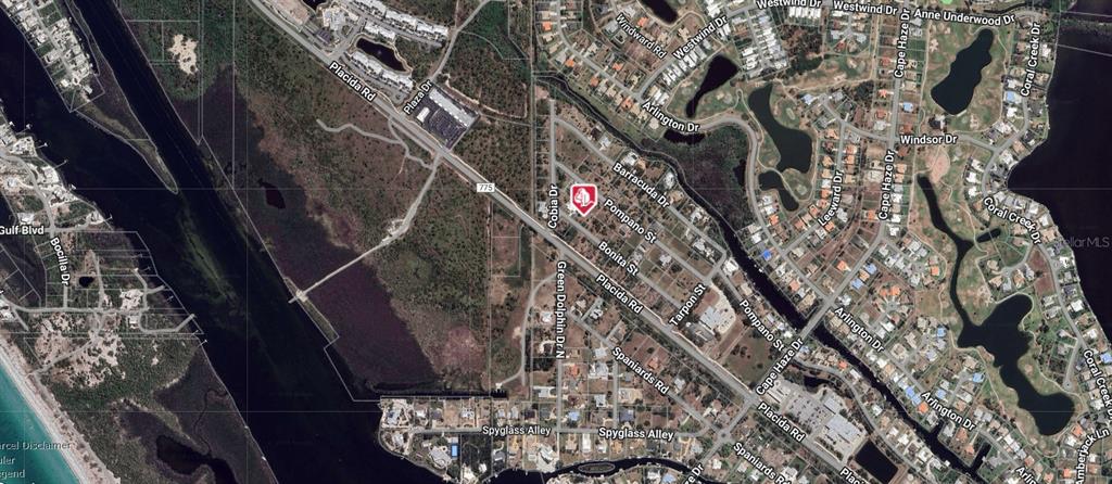 This is an aerial map view of a residential neighborhood near a waterway and road — 50 BONITA STREET, PLACIDA, FL
