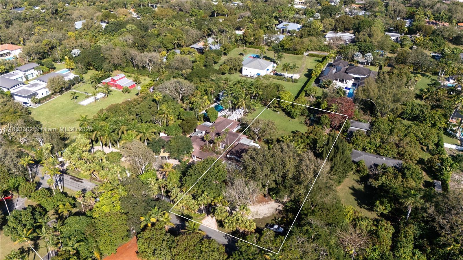 An aerial view shows a large residential property with a house surrounded by dense trees — 6767 SW 67th St, South Miami FL 33143, SOUTH MIAMI, FL