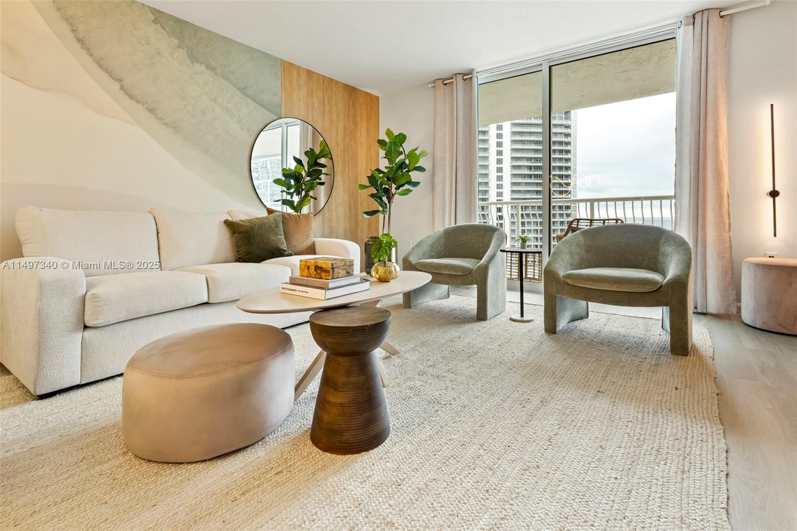 A living room features a white sofa, two green armchairs, and a balcony view — 1200 Brickell Bay Dr # 3619, Miami FL 33131, MIAMI, FL