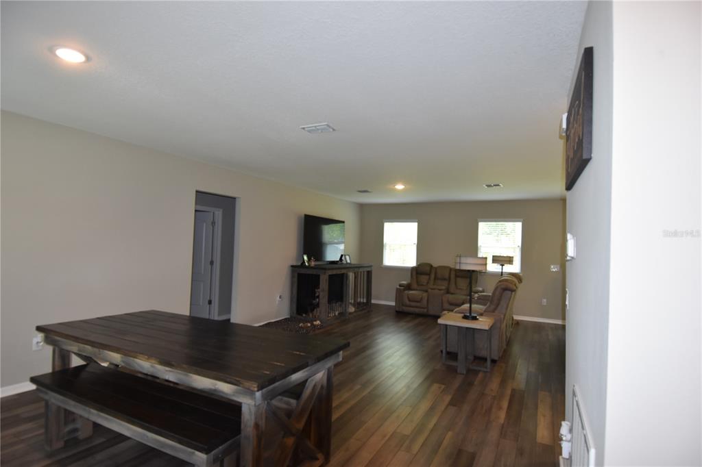 A single-story house with a gray garage, stone accents, and a front porch — 14241 RAVINE AVENUE, WEEKI WACHEE, FL