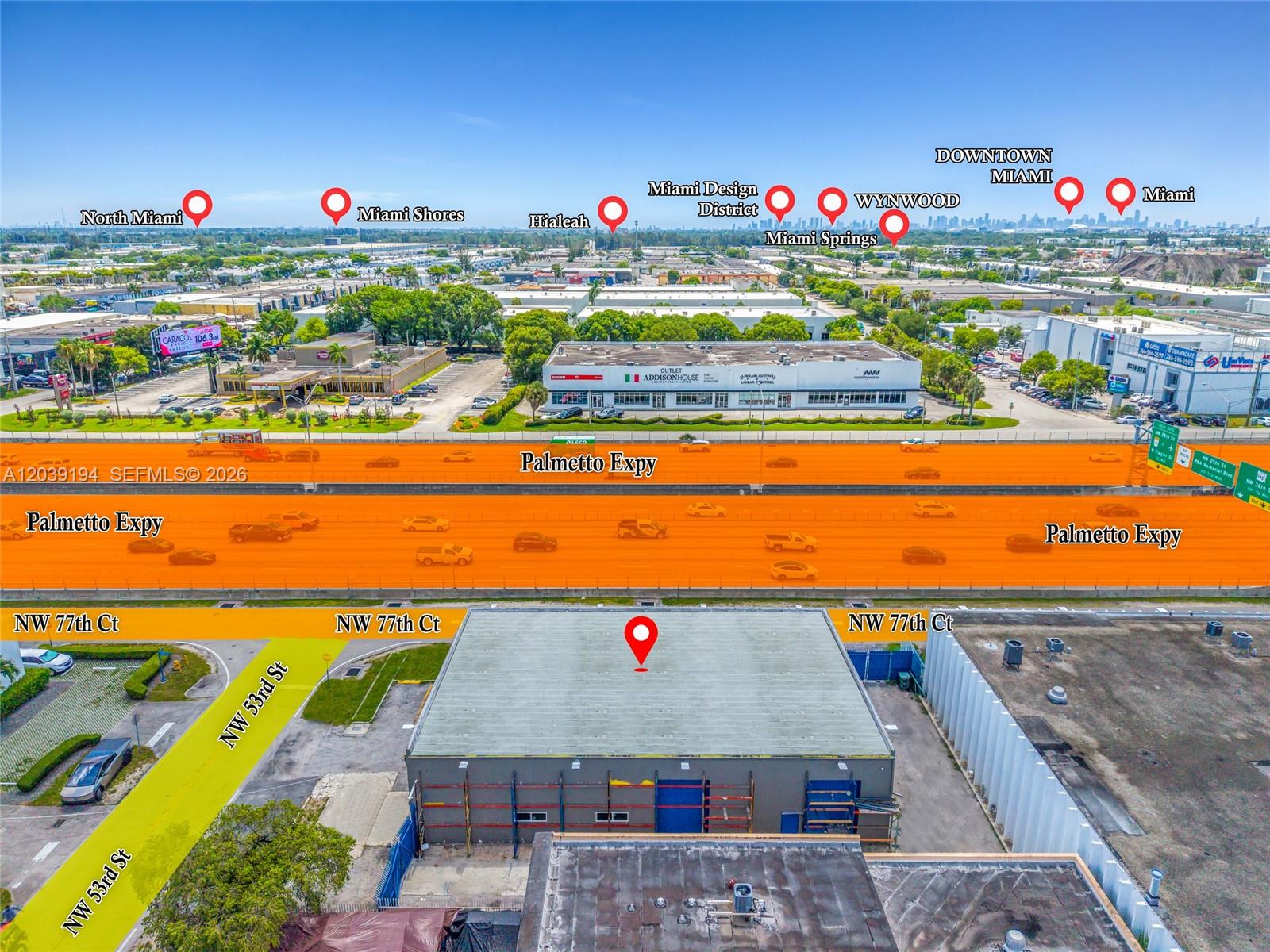 This aerial view shows a commercial building located next to the Palmetto Expressway — 5280 NW 77th Ct, Doral FL 33166, DORAL, FL